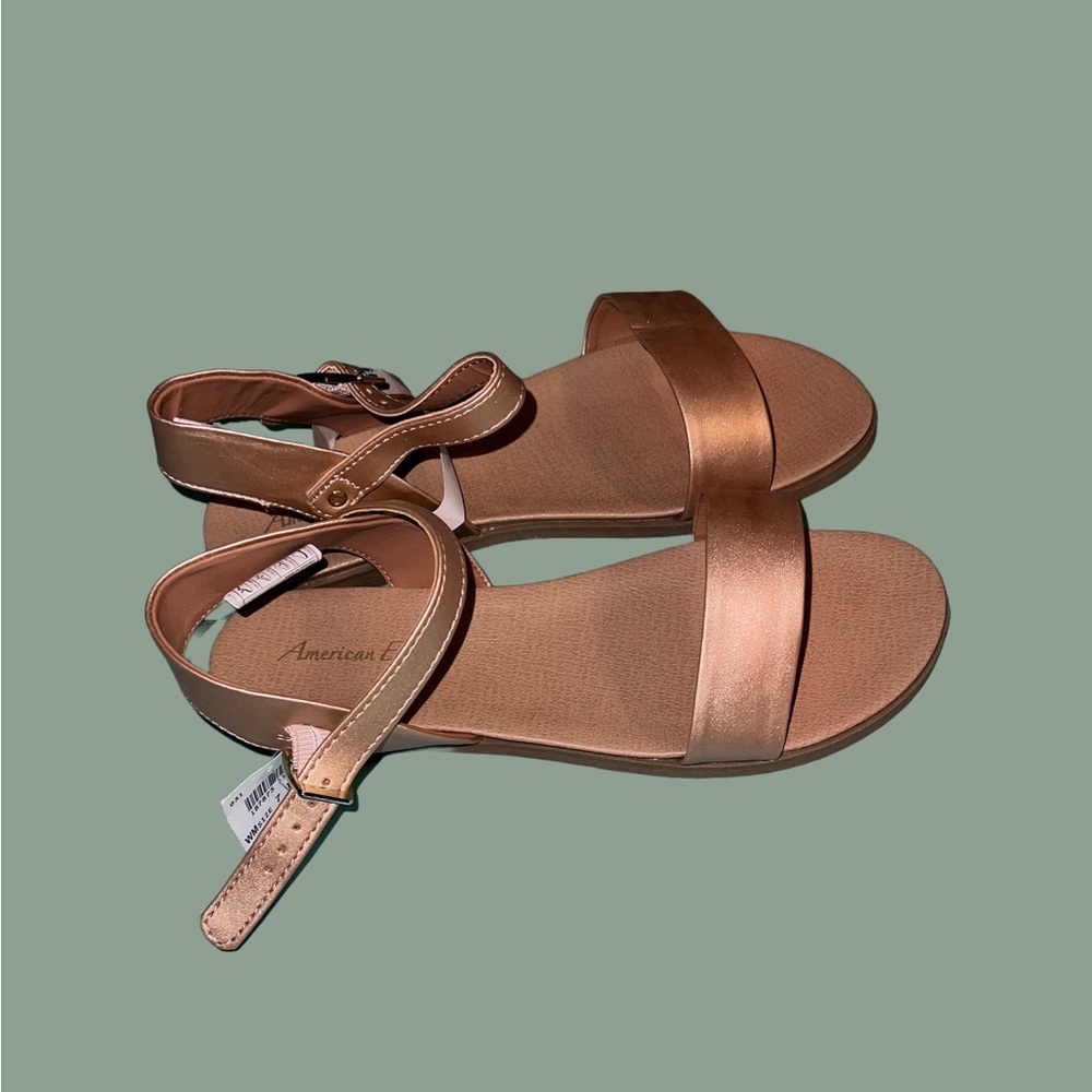 Dressy flat sandals in rose gold